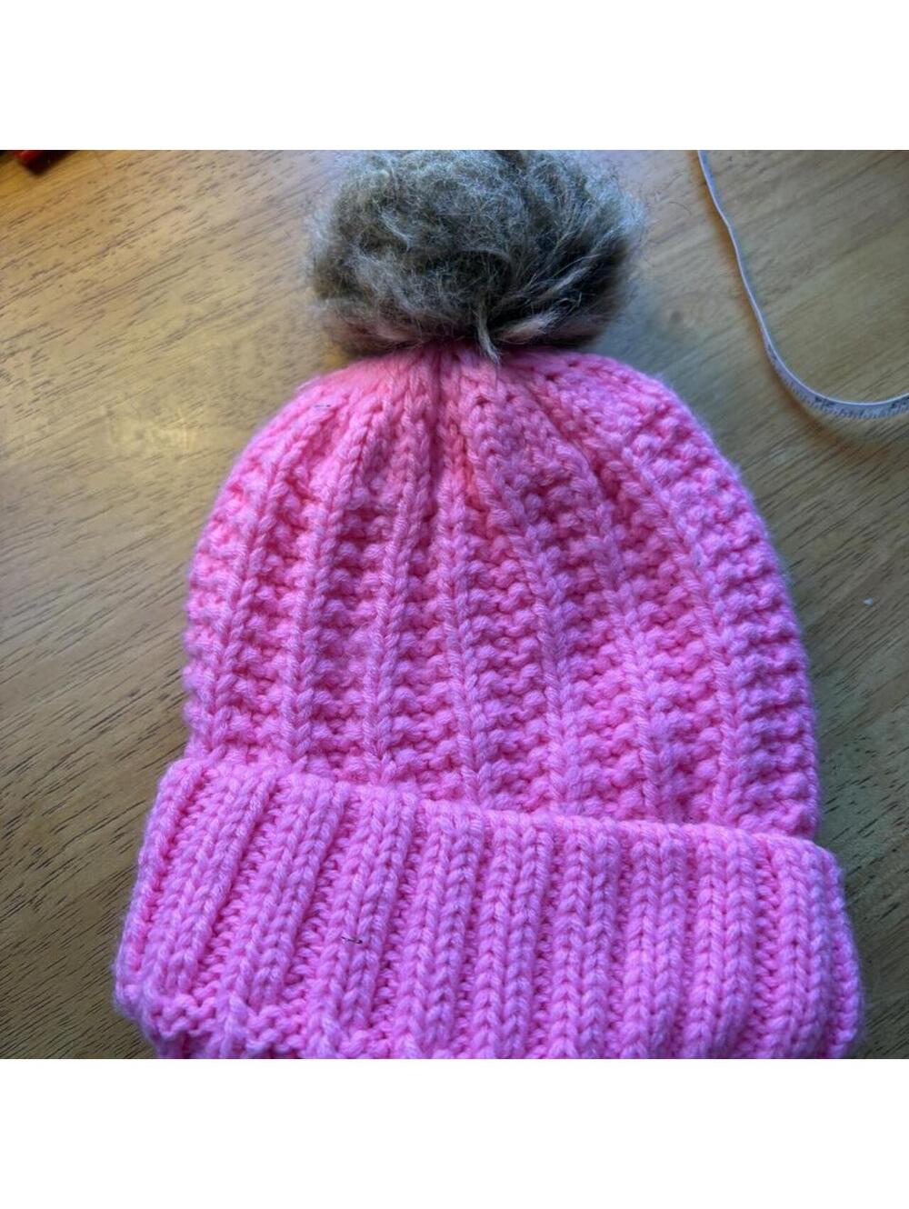 Pink knitted beanie with faux fur trim and pom pom #winteraccessories #cozy